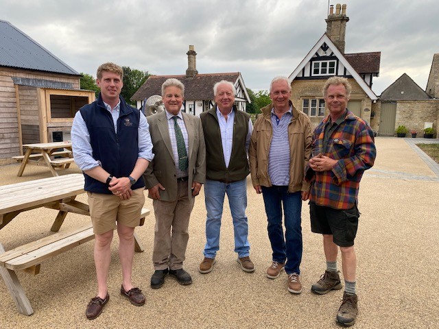 lord apsley, lord bathurst and the owners of hailey wood sawmill with alexander bathurst standing in the courtyard of the old kennels, cirencester park